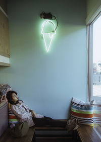 Smiling boy in illuminated room