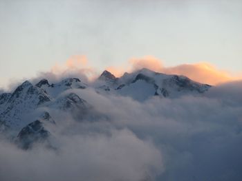 Scenic view of snow mountains against sky