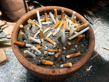 High angle view of cigarette in container