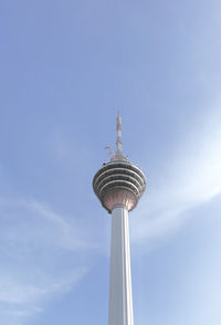 Low angle view of kl tower against sky.