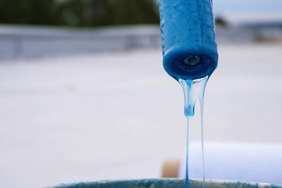 Close-up of water pouring from faucet