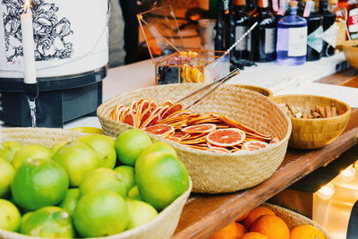 Christmas market stall with fruits and drinks.