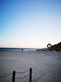 Scenic view of beach against clear sky