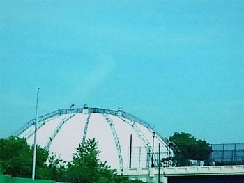 Low angle view of bridge against clear blue sky