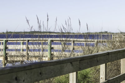 Close-up of railing against sky