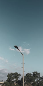 Low angle view of street light against sky