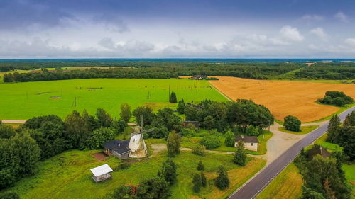 Scenic view of agricultural field against sky