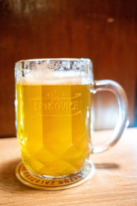 Close-up of beer glass on table