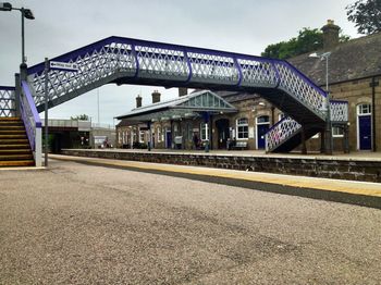 Traditional footbridge at a rural railway station, u.k. 