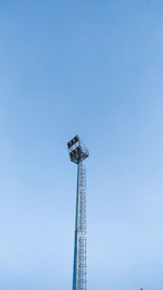 Low angle view of floodlight against clear blue sky