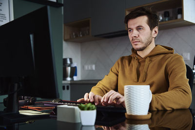 Man working late remotely at home