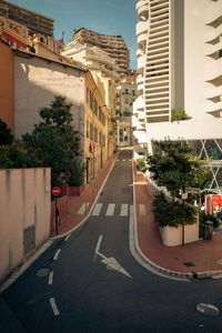 Road amidst buildings in city