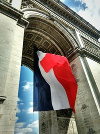 Low angle view of flag against sky