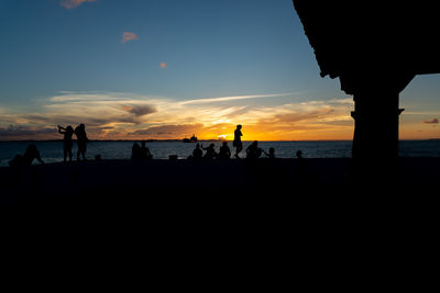 Tourists are seen enjoying the sunset at ponta do humaita in the city of salvador, bahia.