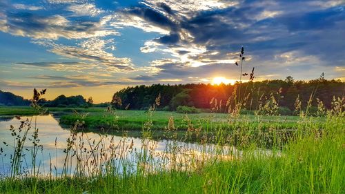 Scenic view of landscape at sunset