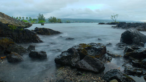 Silky waves on a rocky beach in hawaii