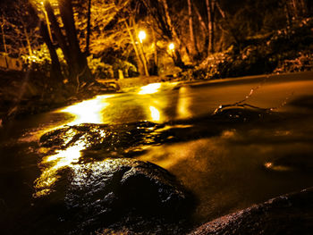 Scenic view of river during winter at night