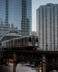 View of railroad tracks and buildings in city