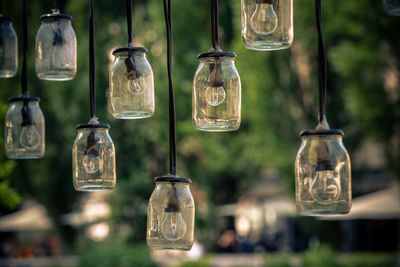 Close-up of light bulb hanging in glass