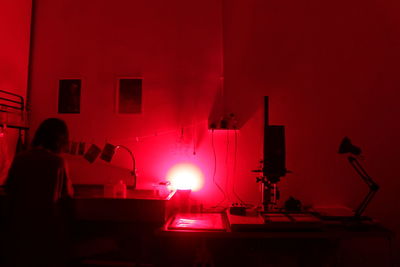 Midsection of woman using laptop on table