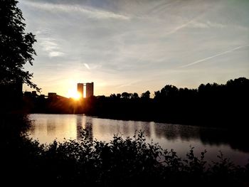 Scenic view of lake against sky during sunset