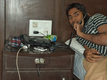 Man working on escalator in office