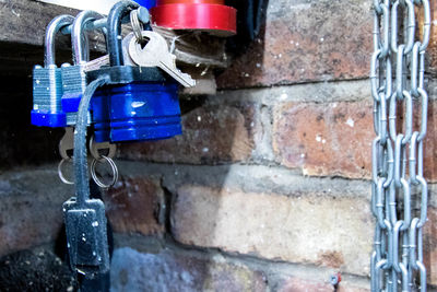 Close-up of padlocks hanging on wall