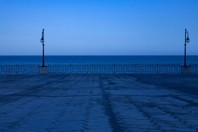 Scenic view of sea against clear blue sky