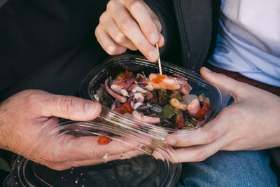 Midsection of woman holding food