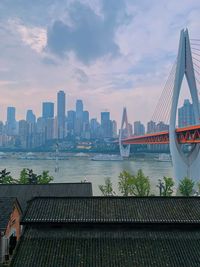 Bridge over river with buildings in background