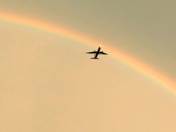 Low angle view of rainbow in sky