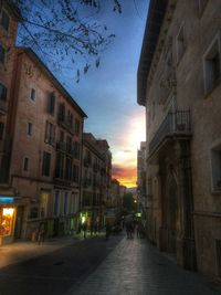 View of city street at sunset