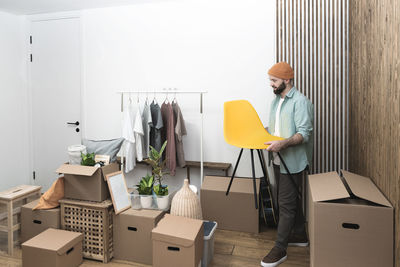Adult man moving in new unfurnished apartments
