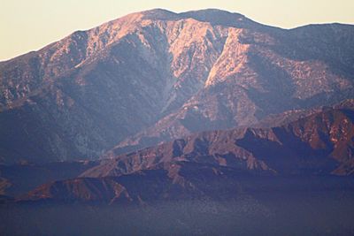 Aerial view of mountain range against sky