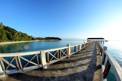 Scenic view of sea against clear blue sky