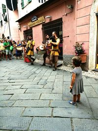 Side view of woman walking on street