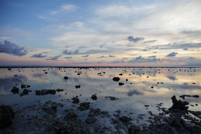 Reflection of sky on beach