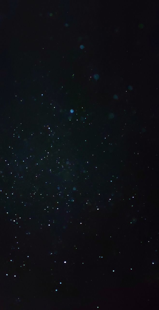 LOW ANGLE VIEW OF STAR FIELD AGAINST SKY