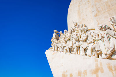 Low angle view of building against clear blue sky