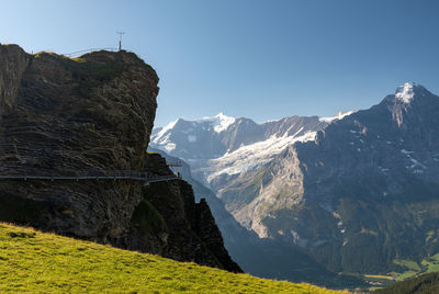 Scenic view of snowcapped mountains against clear sky