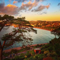 Scenic view of river at sunset