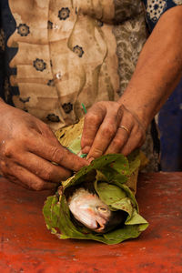 Midsection of woman preparing food