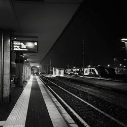 View of railroad station platform at night