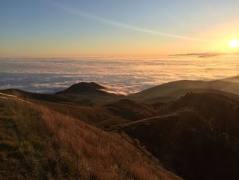 Scenic view of landscape against sky during sunset