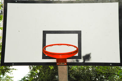 Close-up of basketball hoop against wall