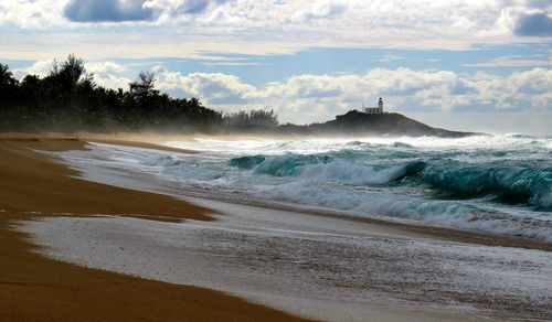 Scenic view of beach against sky