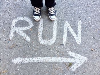 Low section of people standing on street