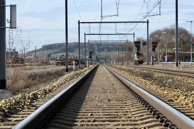 Surface level of railroad tracks against sky