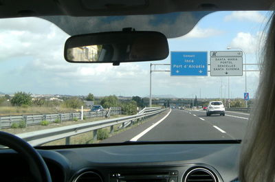 Road seen through car windshield