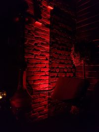 View of illuminated red wall at home